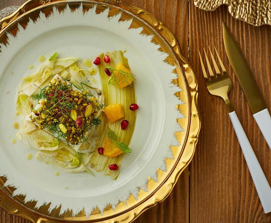 Baccalà in crosta di pistacchi, olio agli agrumi finocchi e melagrana Protein